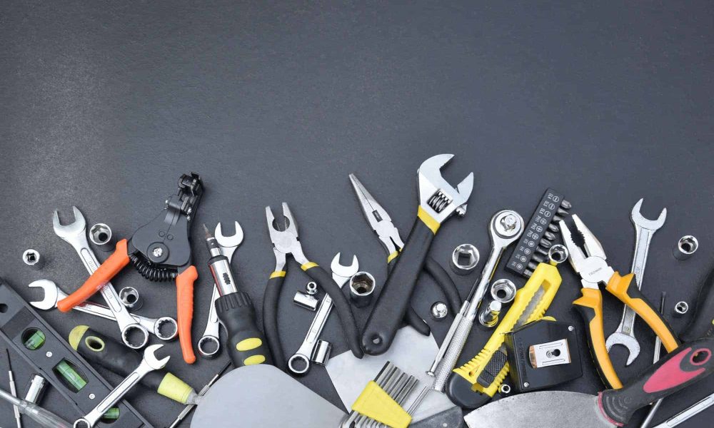 handyman-tool-kit-on-black-wooden-table-many-wrenches-and-screwdrivers-pilers-and-other-tools-for.jpg